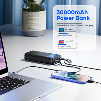 30000mAh power bank with 65W USB-C PD charging a laptop and smartphone on a desk