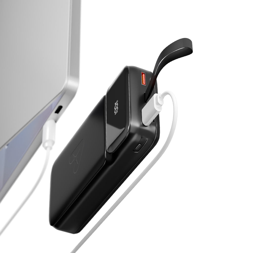 Black power bank with digital battery display charging a smartphone via USB cable