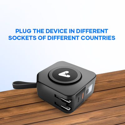 Universal travel adapter with multiple plug options on a wooden surface, ideal for international charging.