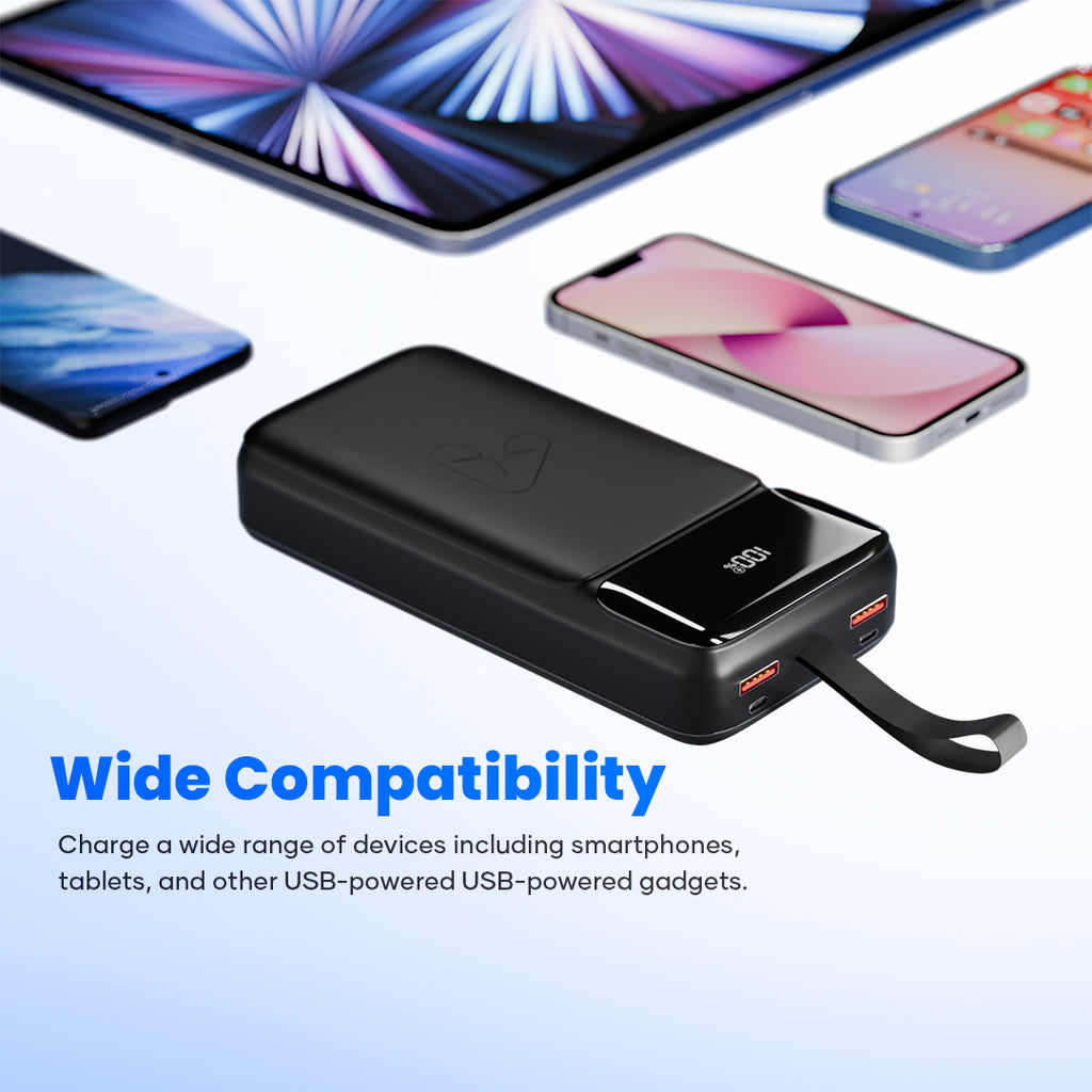 Black USB power bank with digital display charging smartphones and a tablet, wide compatibility